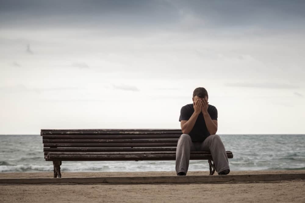 sad lonely man on bench