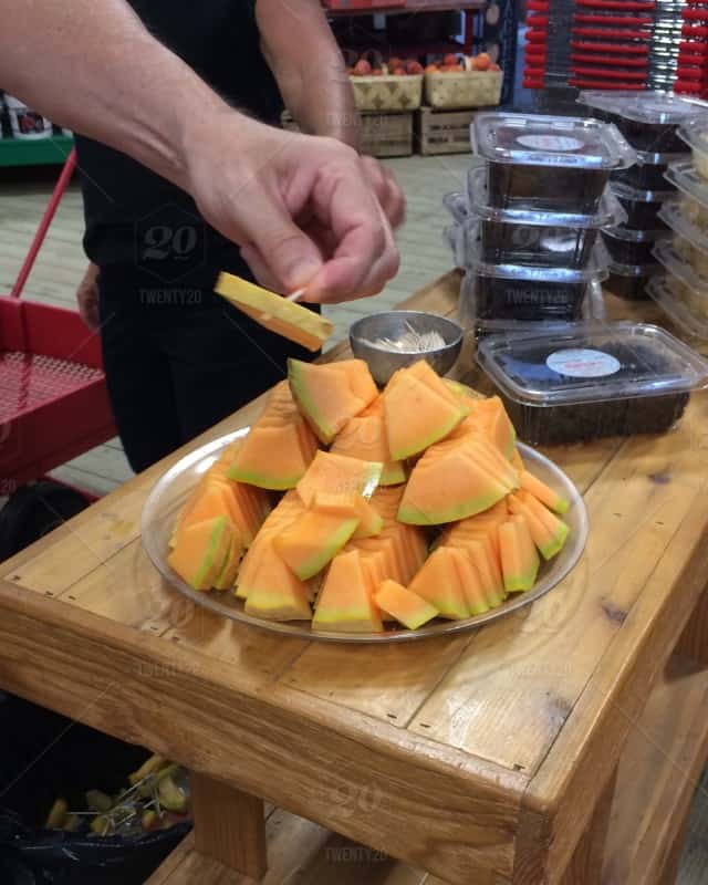 stock photo fruit freshness fresh healthy melon cantaloupe fresh fruits customer hand in frame adb ce d bce bdfd